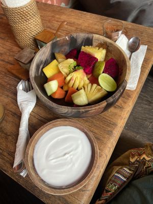 Fruit salad with coconut yoghurt  at The Garden Kafe at The Yoga Barn in Ubud