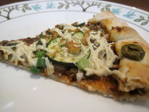 Mosaïque pizza with zucchini, green peppers, mushrooms, green olives, green onions and Daiya cheese. Pretty good. at Vegan Rapide - Sherbrooke in Montreal