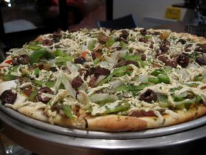 Traditional pizza with Daiya cheese at Vegan Rapide - Sherbrooke in Montreal