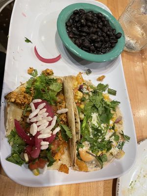 Bollywood taco with Chofu protein, Bowtie taco with spiced potato protein and side of black beans  at Crafted The Art of the Taco in Greensboro
