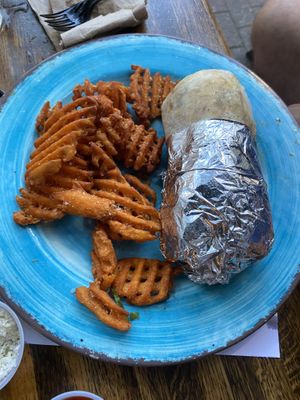 Vegan burrito with sweet potato fry side at Crafted The Art of the Taco in Greensboro