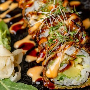 The Crunchy Roll, with steamed sweet potato, avocado, mango, cucumber, and radish. Topped with teriyaki mayo at Vilai Vegan House in Hamburg