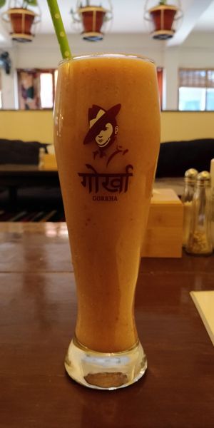 Places' house smoothie (banana, papaya, seasonal fruits. Coconut milk) at Places Restaurant and Bar in Kathmandu