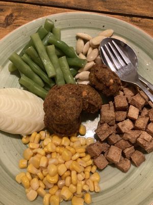 Healthy plate: lots of ingredients to compose your meal, I choose falafel, mashed potatoes, tofu, green beans, sweet corn, almonds   at Places Restaurant and Bar in Kathmandu