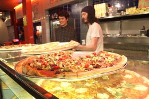 Serving up the pizza's at Voo Doo Rays. at Voodoo Rays - Dalston in East London