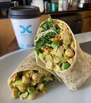 Curry Chickpea Wrap
Chickpeas, Celery, Almonds, Currants and Peas tossed  in toasted curry spices and veganaise topped with Pickled Carrots and Arugula and wrapped in tortilla at Cloud City Coffee in Seattle