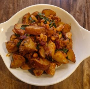 Vegan Smash-Up (ve)(gf): Mini Roast Potatoes mixed with spinach and posh beans. Add vegan sausage at Smoke  in Wilmslow