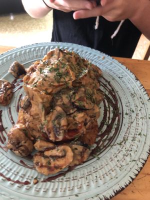 Balsamic reduction sauce with mushrooms, eggplant over hash browns at Arbol de Seda in San Jose