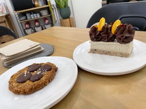 Chocolate chip cookie & vanilla raw cake with dark chocolate frosting   at Dates & Avocados Atelier in Barcelona