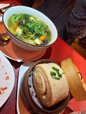 With bread roll at Ama Tibetan Mom's Kitchen in Bruges