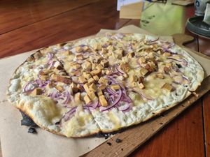 Flammkuchen mit Räuchertofu und Käse at Lebenshof MutimBauch in Ottenhoefen Im Schwarzwald