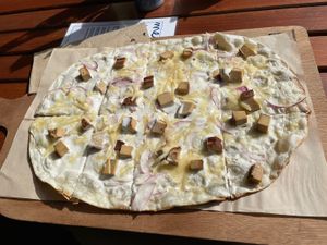 Flammkuchen with tofu, onions and cheese  at Lebenshof MutimBauch in Ottenhoefen Im Schwarzwald