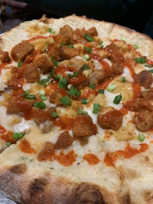 Vegan Nick Fury- vegan chickn, scallions, Alfredo sauce, vegan Mac and cheese, sriracha.  at Flying Saucer Pizza Company in Salem