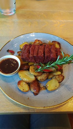 Redefined Meat Flank Steak with rosemary potatoes and grilled vegetables at The ASH in Dortmund