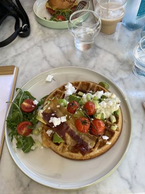 Breakfast waffle with vegan bacon, feta, tomatoes and avocado  at Morning People in Marbella