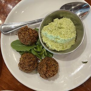 side of falafel with edamame hummuss  at Panini Kabob Grill in San Diego