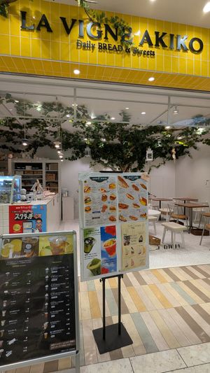 Four vegan marked burgers on the menu at La Vigne Akiko - Sunshine City in Tokyo