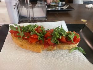 Bruschetta with tomatoes and rocket  at La Polse Osteria Caffe in Udine