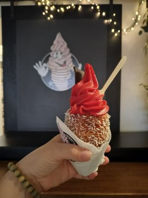 Raspberry gelato with coconut cone 😍 at Little Chimney Gelato & Bakery in Prague