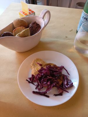 Their "welcome plate" with chickpea hummus, roasted eggplant and red cabbage. at È cucina Marrett in Bologna