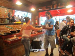 Staff periodically step out from behind the cash register and serving line to dance. at Tacos Gus in Mexico City