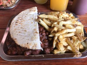 5 bean chili black bean burger with caramelized onions and sautéed mushrooms on an arepa with French fries and homemade ketchup. at Brunch de Salento in Salento