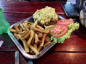Vegan “holy guacamole" burger on whole wheat bread with fries (22.000 COP) at Brunch de Salento in Salento