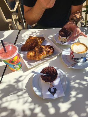 Vegan chocolate ice cream, smoothie, cappuccino, 2 filled croissants: one with berries and one with mango/passion fruit marmelade. at Regina di Coni in Olbia
