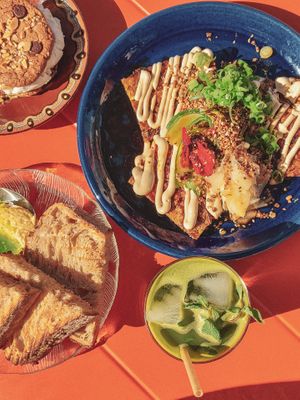 Japan-inspired menu with an amazing okonomiyaki, choc-chop cookie with vanilla ice cream, and a matcha mint and lemon iced tea, the 18th of July 2025. at Cornershop  in Johanneshov