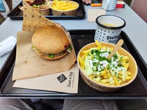 Pink burger and Greek fries at Swing Kitchen in Zurich