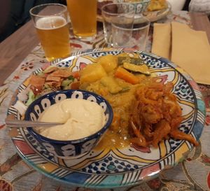 Cous cous, bademjan, fattoush, verdure al curry, hummus. Saffron blanche beer. at Peace ‘n' Spice  in Padua