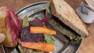 Pickled carrot and beetroot on sourdough, garlic and herb cream cheese at Something More Productive in Manchester