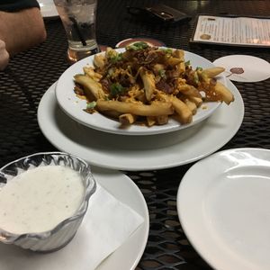 Vegan cheese fries with fake bacon and vegan ranch  at Trinity Hall in Dallas