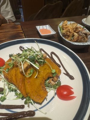 pumpkin with garlic sauce and fried mushrooms  at Dana Vegan House in Hanoi