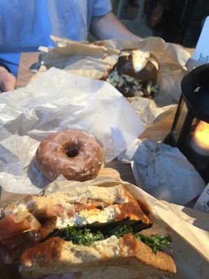 Beast burger, grilled tofu baguette and strawberry glazed donut at The Cinnamon Snail in New York City