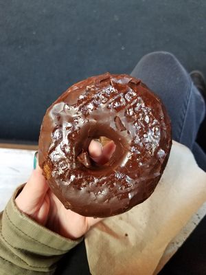 Vegan donut with chocolate icing at The Cinnamon Snail in New York City