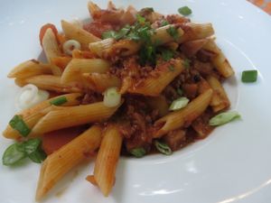 Kostbar Penne with fried Mediterranean vegetables, rocket leaves and hot tomato sauce at Restaurant Café Kostbar in Saarbrucken