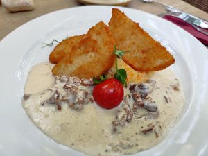 Celery escalope with chanterelle herb sauce and mashed potato and carrots at Restaurant Café Kostbar in Saarbrucken