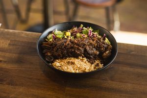 Buddha Bowl - Fresh salad of Lettuce and Red Cabagge with Corns and Olives with Aioli Dressing, Brown Rice and a Flavor of Choosing, (Vegan Mince, Hummus, Curry Paste or Mushrooms) at The Others Cafe in Christchurch
