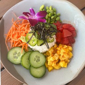 Suika Poke Salad Bowl -marinated watermelon, spiced mango, edamame,
jalapenos, avocado, cucumber, carrots, sushi rice, sesame oil and rice vinegar at Jackson's Bistro in Tampa