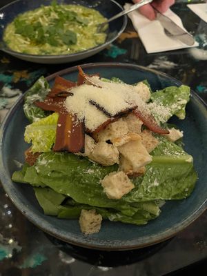 Caesar salad with La Vie bacon and vegan parm at AMPM Restaurant in Belfast