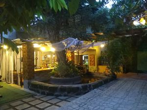 behind the tree are the "indoor" tables at Satya Graha in Los Banos