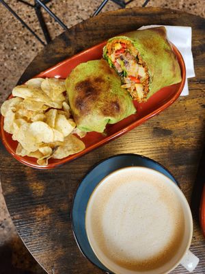 this is the vegan chorizo wrap (all lunch comes with side of salt and pepper chips) and a london fog with oat milk at The Stray in Grand Rapids