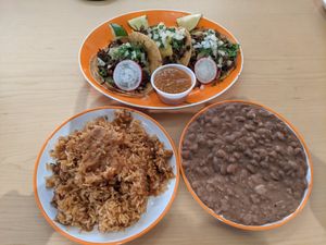 Taco plate with three tacos, rice and beans at La Venganza in San Francisco