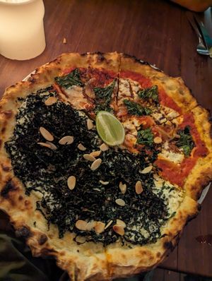 Vegan pizza, half white and half red at Cafe Zorba in Medellin