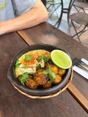 Sizzling papas bravas at Cafe Zorba in Medellin
