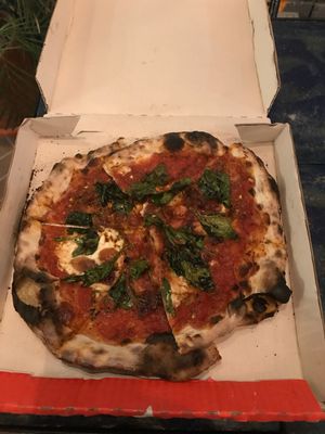 Espinaca pizza with vegan cheese made from macademia. at Cafe Zorba in Medellin