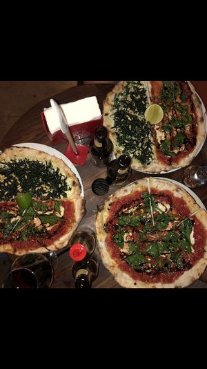 The vegan pizzas. Half spinach/tomato, half kale/macadamian creme. at Cafe Zorba in Medellin