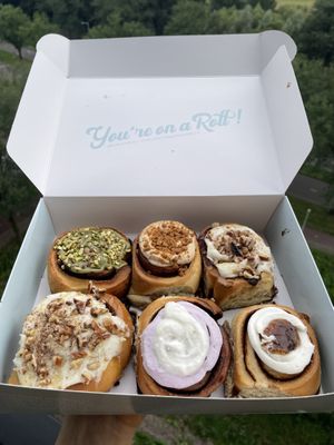 Top row: pistachio roll, Speculoos roll, pecan-caramel roll. Bottom row: Pecan-caramel roll, lime lavender roll, orange blossom-fig roll  at Have a Roll in Utrecht