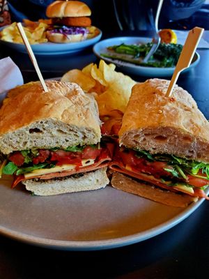 The Grinder - really good!! Served with warm potato chips 😋 at 3 Howls Remedy House in Vancouver